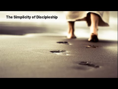 Person walking barefoot on the beach, symbolizing discipleship and spiritual journey.