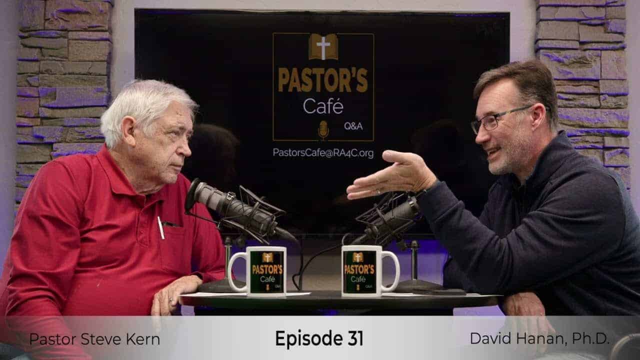 Pastors training session with two speakers discussing ministry strategies.