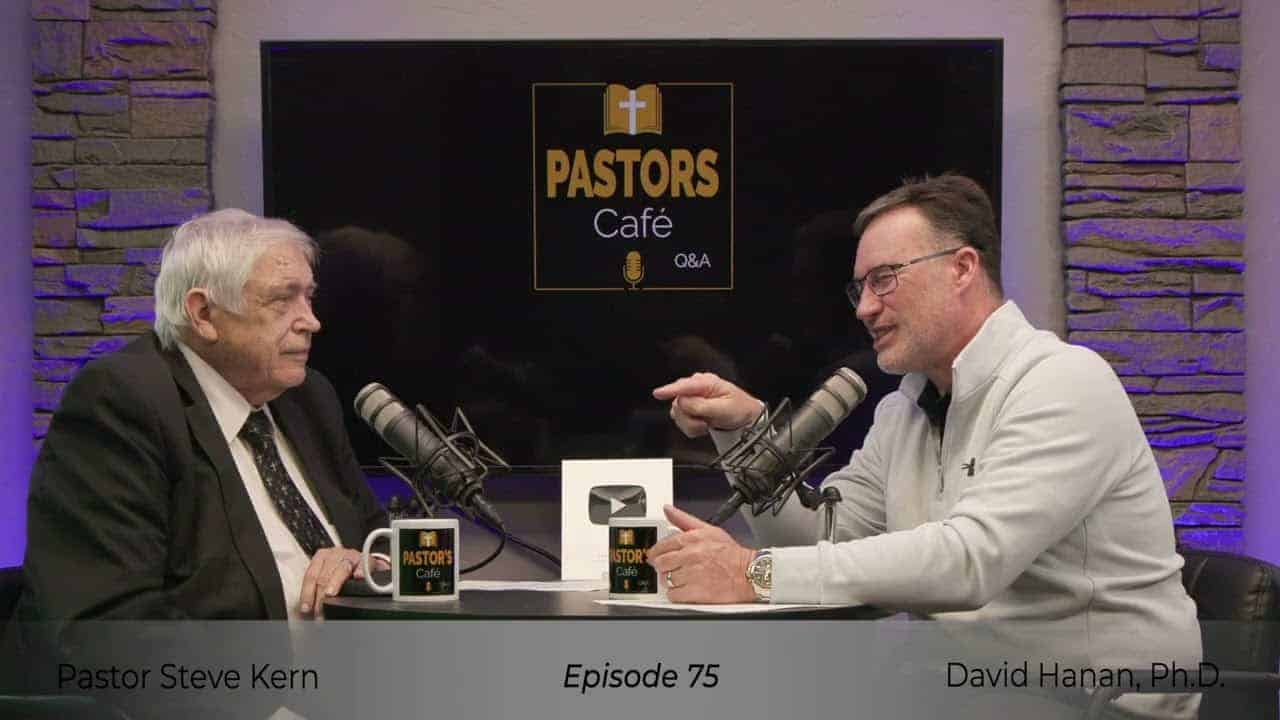 Two pastors engaged in discussion during Liberty Pastors Training event.
