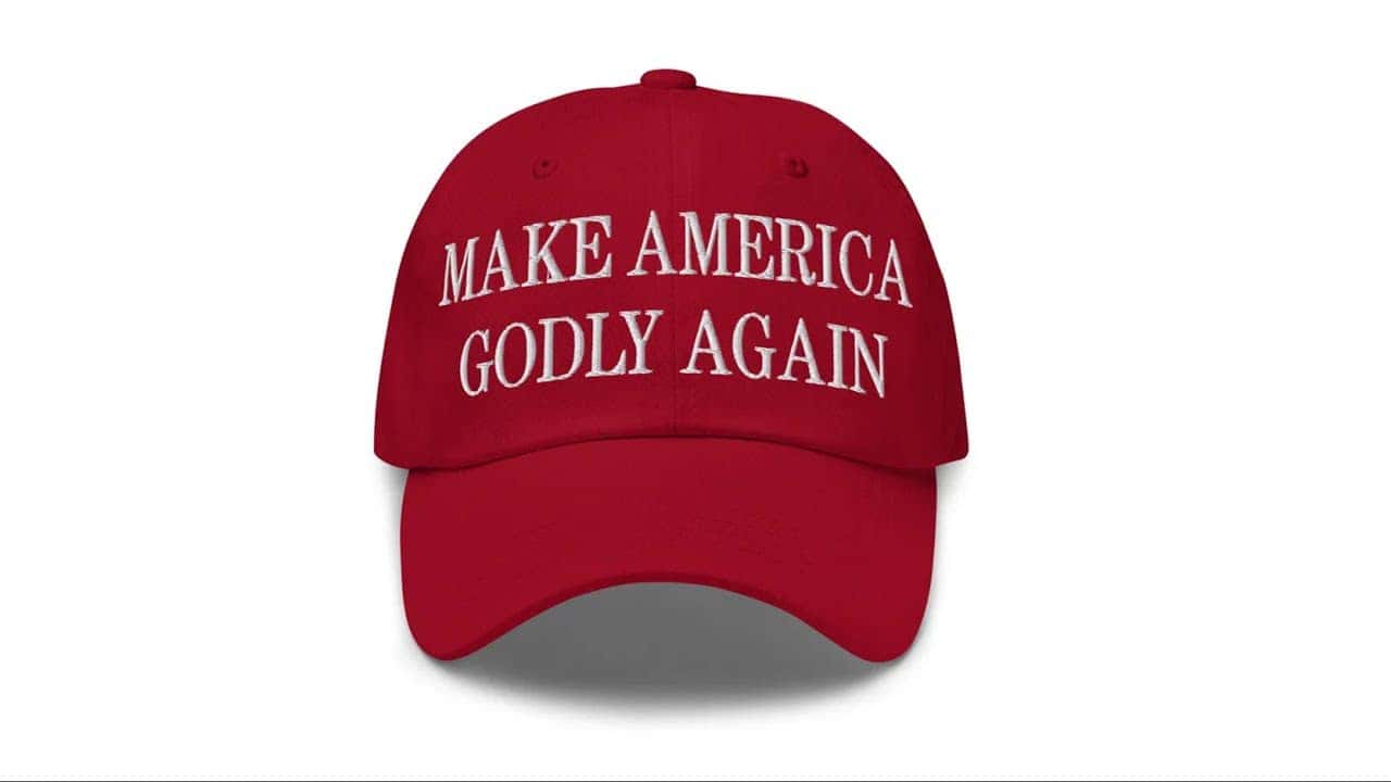 Red baseball cap with "Make America Godly Again" slogan for conservative values.