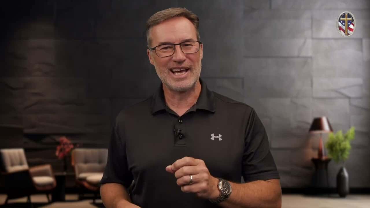 Man speaking at Liberty Pastors Training event in a modern setting.
