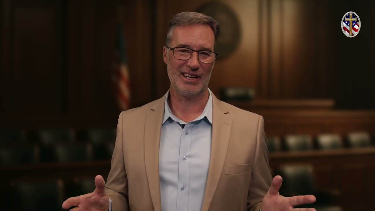 Man speaking at Liberty Pastors Training event in a formal setting.